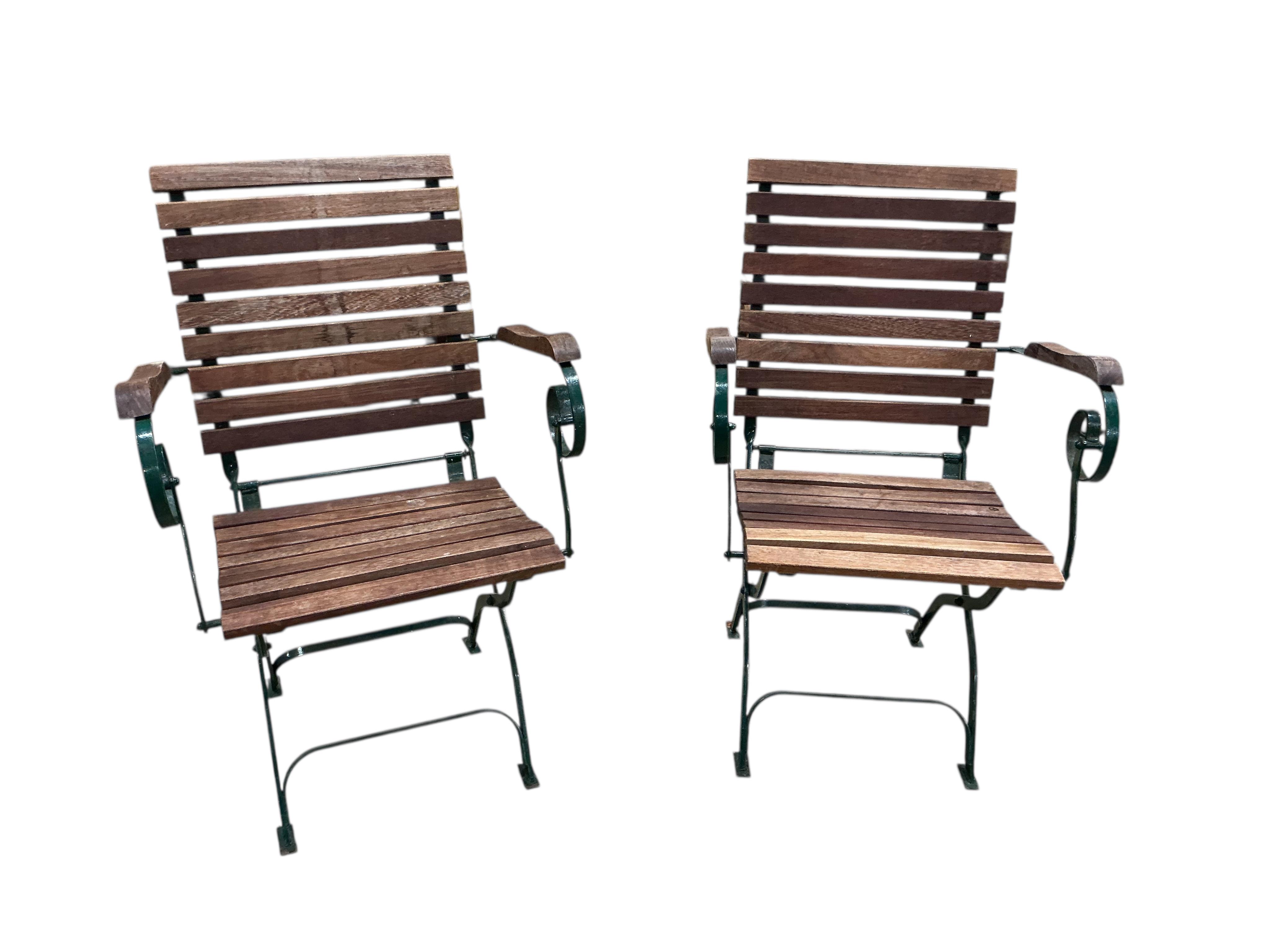 A set of four slatted teak and green painted wrought iron folding garden chairs, width 58cm, depth 50cm, height 91cm